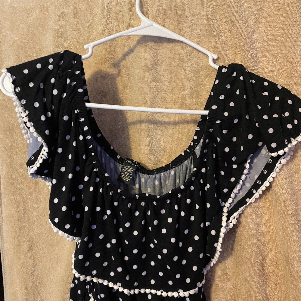 Black romper with white polka dots